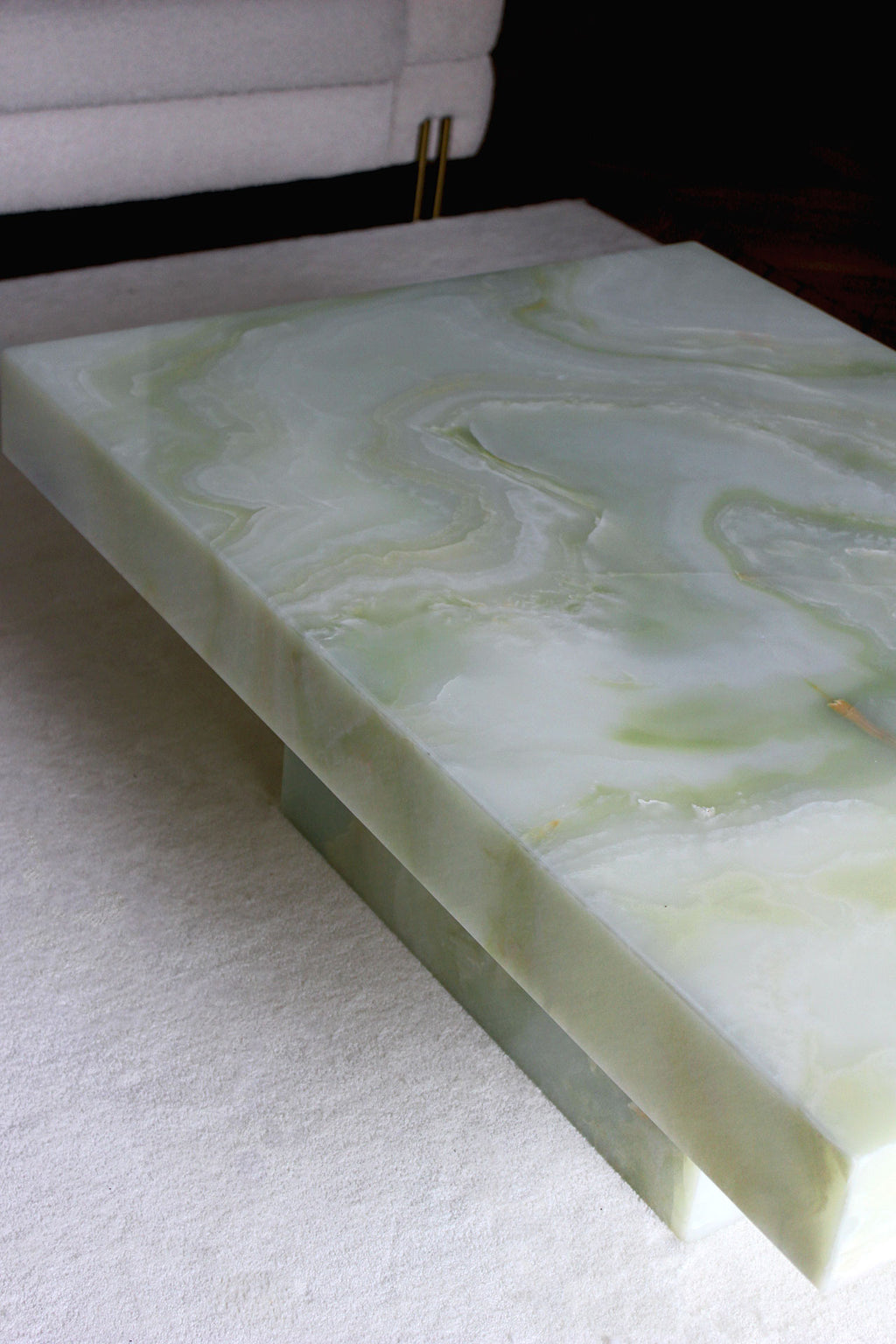 Detail shot of green onyx marble veining on Cara coffee table - premium Italian stone craftsmanship