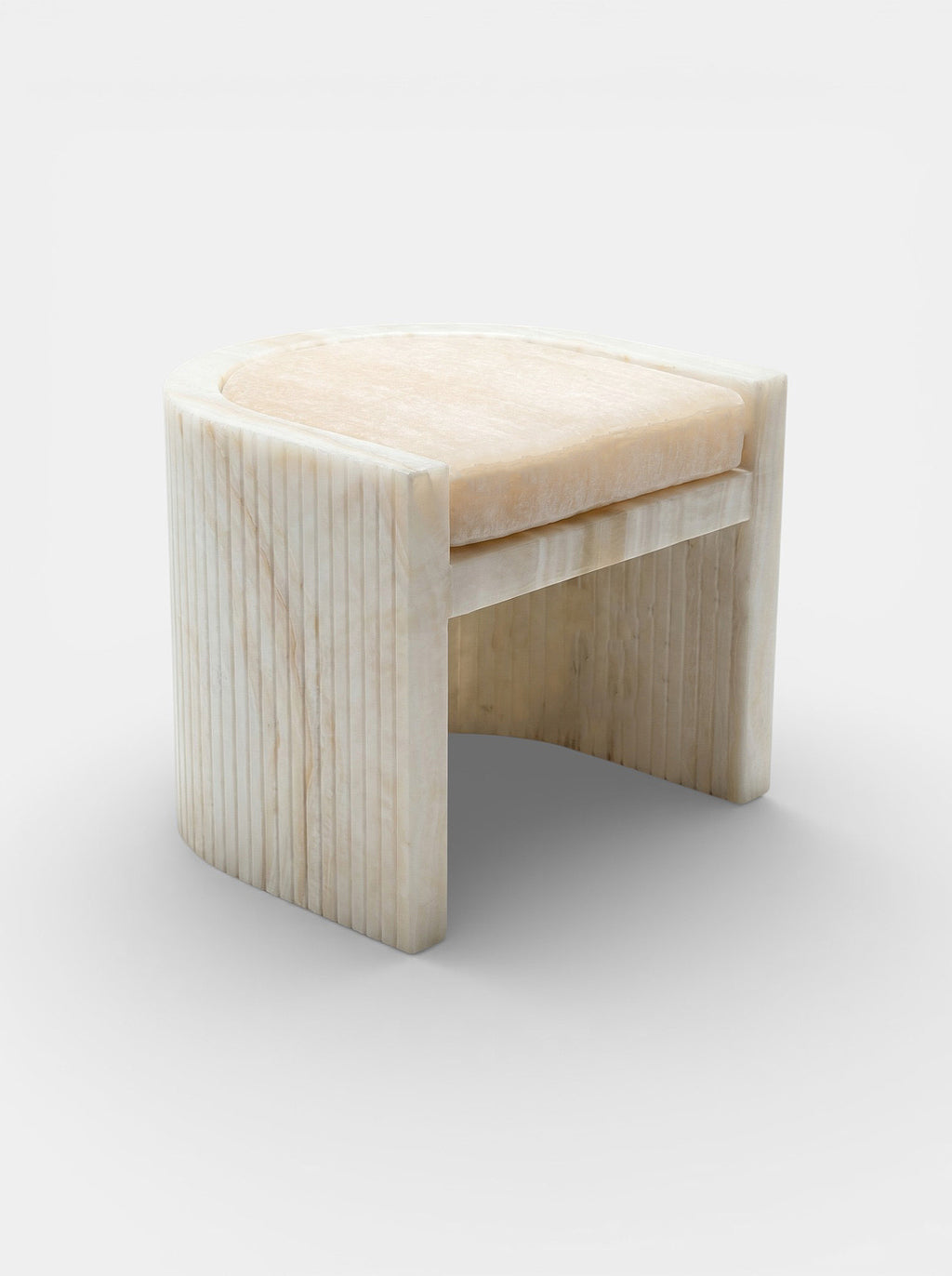 Side view of Loris ivory onyx chair showcasing curved marble design - handcrafted Italian luxury